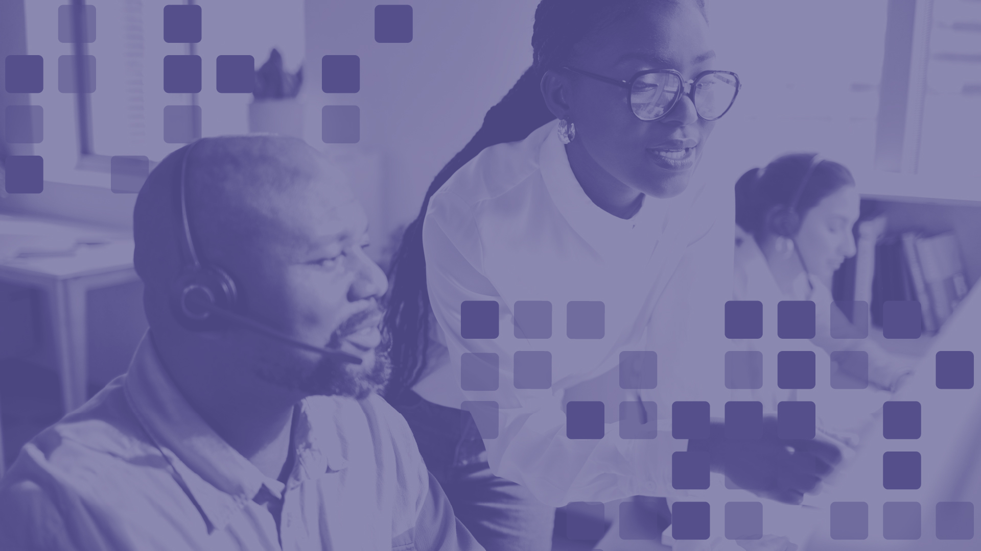 Computer support specialists assisting users in a technology support environment, representing IT jobs that can be pursued without a four-year degree.