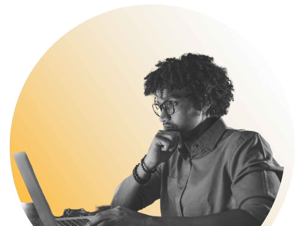 man using computer while concentrating