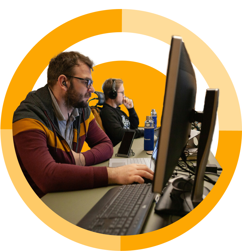 two men using computers in computer lab